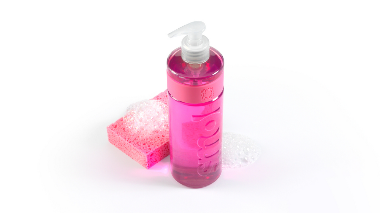 smol's grapefruit washing up liquid bottle placed beside a foamy pink sponge